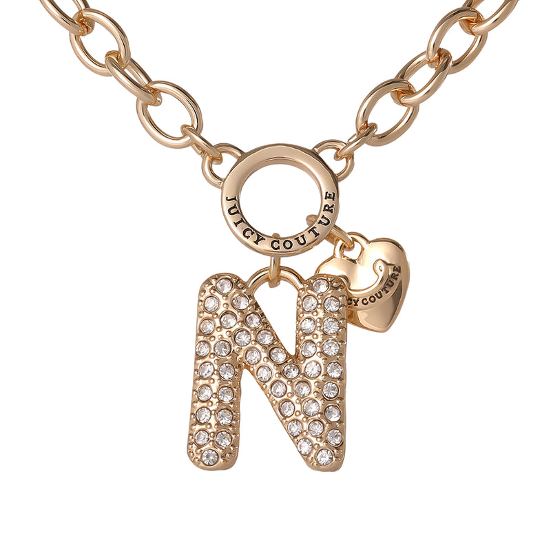 Introducing the Bubble Initial Necklace, Letter N: a gold chain necklace featuring a rhinestone-studded letter N pendant and a dainty gold heart charm engraved with JUICY COUTURE. This iconic piece captures the playful spirit of Y2K jewelry, making it the perfect eye-catching initial necklace from Juicy Couture.