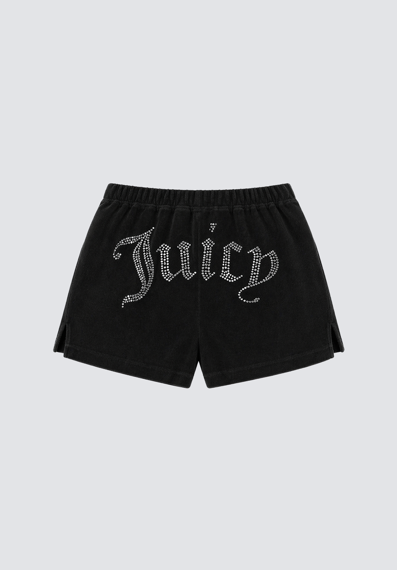 The Big Bling Washed Terry Shorts feature black velour fabric, a rhinestone Juicy logo on the front, elastic waistband, small side slits, and relaxed fit. Displayed on a plain light gray background.