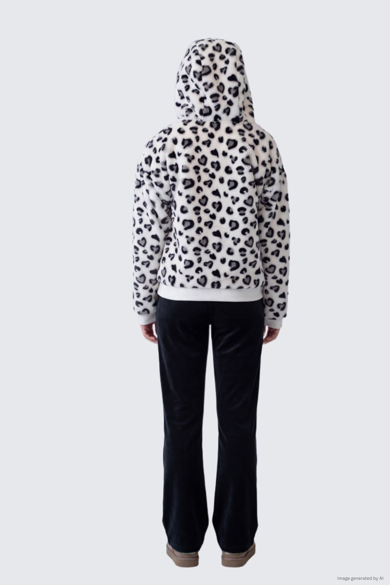 A person seen from behind wearing a plush leopard-print Fur Jacket with a hood and dark trousers.