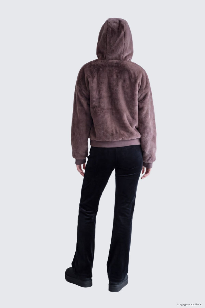 Person from behind wearing a brown Juicy Fur Jacket faux fur hoodie, black trousers, and platform shoes.