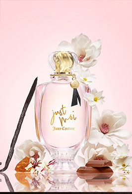 Perfume bottle with flowers on a pink background