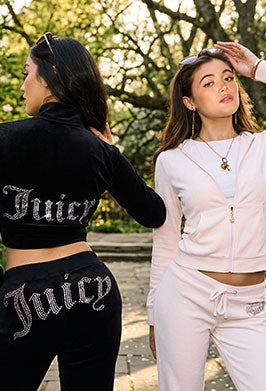 Two women in tracksuits in a garden