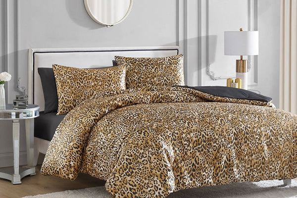 Bedroom featuring leopard print sheets and pillows