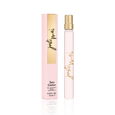 A slim, clear Just Moi Eau de Parfum Spray Pen, 0.33 fl oz by Juicy Couture sits beside its pink and gold box, presenting a feminine scent in a chic design.