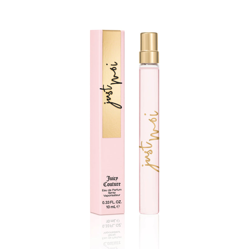 A slim, clear Just Moi Eau de Parfum Spray Pen, 0.33 fl oz by Juicy Couture sits beside its pink and gold box, presenting a feminine scent in a chic design.