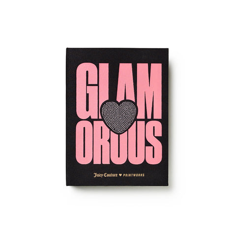 A black jewelry box featuring bold pink text reading “GLAMOROUS” across two lines with a central heart motif, inspired by a chic and glamorous jewelry box design. The bottom showcases “Juicy Couture x Printworks” elegantly printed in gold.