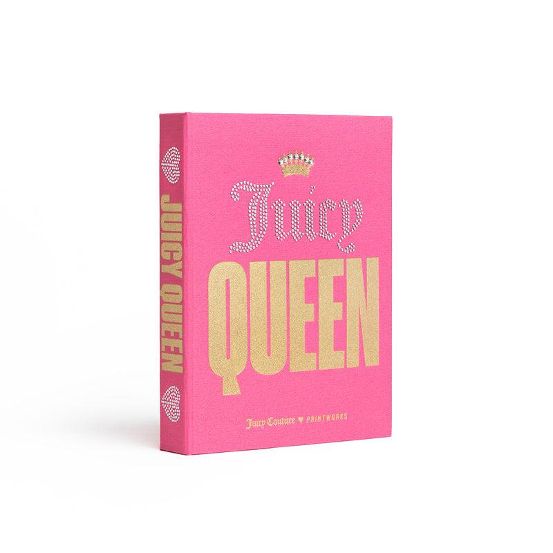 The Juicy Couture x Printworks Jewelry Box is a charming pink, book-inspired storage piece featuring gold and rhinestone-like text reading “Juicy QUEEN” with a small crown above “Juicy.” The spine is detailed with “Juicy Queen” in vertical gold letters, adding a glamorous touch to any space.