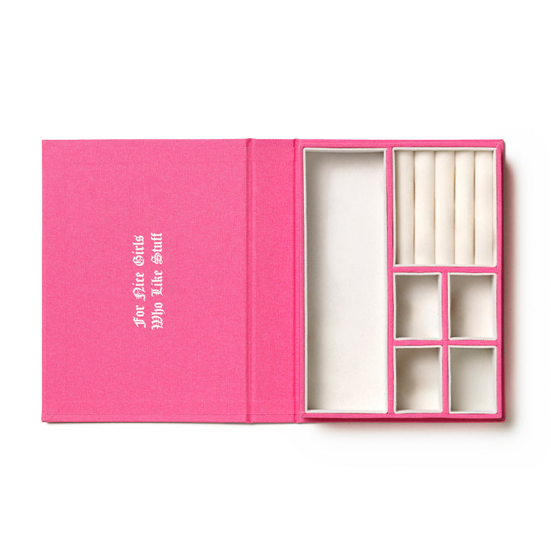 Store your treasures in the Juicy Couture x Printworks Jewelry Box—an open pink jewelry box with multiple compartments and ring slots, featuring a chic inside cover with white text that reads “For the Girls Who Like Stuff.”.
