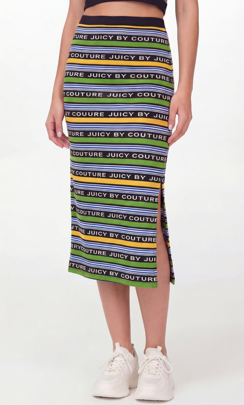 A person wears the Logo Skirt—REJUICED, a fitted, ankle-length skirt with black, yellow, and green stripes and repeated “JUICY BY COUTURE” text in white, styled with white sneakers and a black crop top; details per seller.