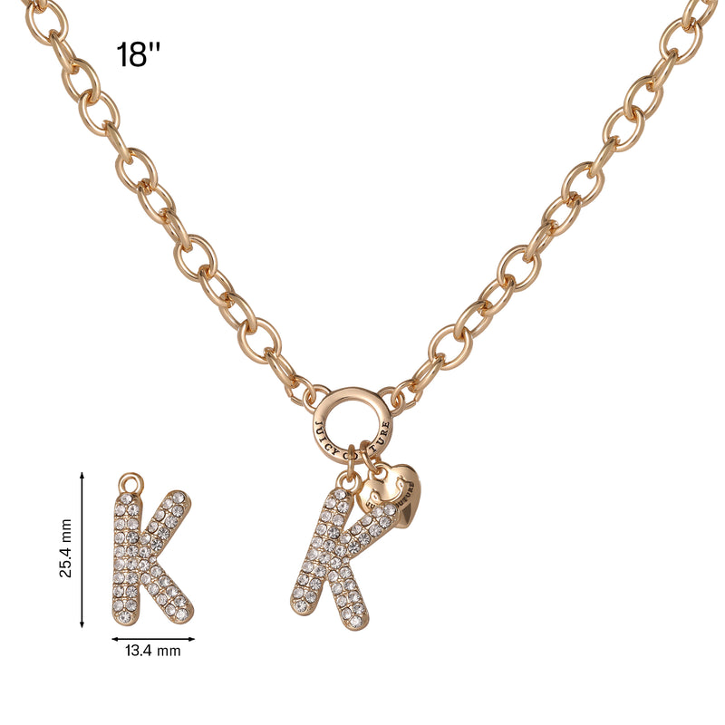 The Bubble Initial Necklace, Letter K, is a gold chain necklace measuring 18 inches in length. It features a hanging bubble letter “K” pendant adorned with small clear stones (25.4 mm by 13.4 mm), and includes a small heart charm for a playful touch, capturing the Y2K aesthetic.