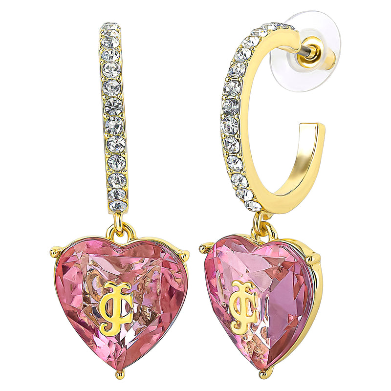 Heart Charm Hoop Earrings featuring gold hoops adorned with clear crystals. Each earring is accented by a dangling pink, heart-shaped gem with a gold JC monogram at the center—perfect for adding a touch of Juicy Couture style to your collection. One earring is displayed facing forward, while the other shows a side view highlighting the post and backing.