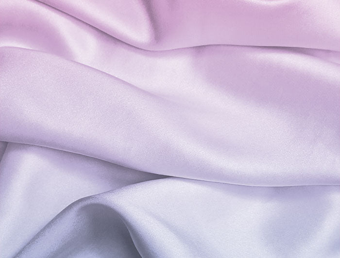 Close-up of gradient purple and blue fabric with soft folds