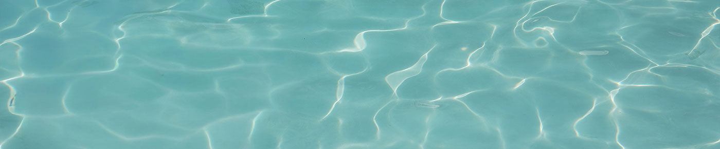 Close-up of clear blue water with light reflections