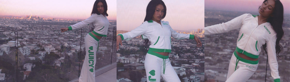 A 3-panel collage of a woman modeling a white and green athletic tracksuit in three vertical panels, posed outdoors against a city skyline at sunset. The outfit includes a zip-front jacket and matching pants with green trim and green lettering.